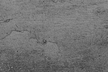 Texture of a concrete wall with cracks and scratches which can be used as a background