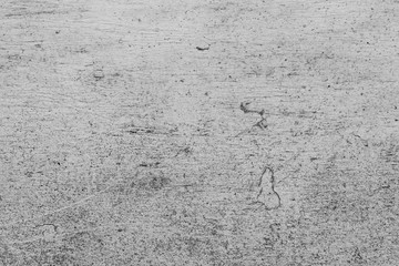 Texture of a concrete wall with cracks and scratches which can be used as a background