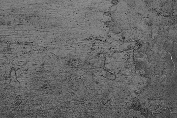 Texture of a concrete wall with cracks and scratches which can be used as a background