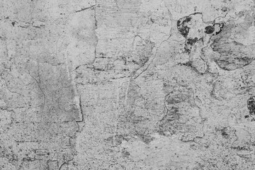 Texture of a concrete wall with cracks and scratches which can be used as a background