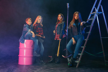 Rebel youth. Full length portrait of cocky children in stylish jeans and leather clothes. Concept...