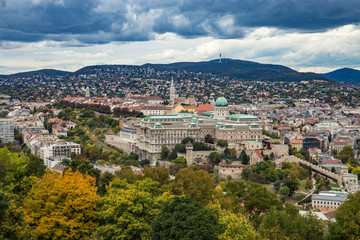 Autumn aerial view from Gellert Hill to Buda Castle and King Palace Budavári Palota of the Hungarian kings on stormy weather