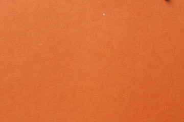 Yellow color cardboard. Clean orange paper texture. High resolution photo. Empty orange backgrounds.