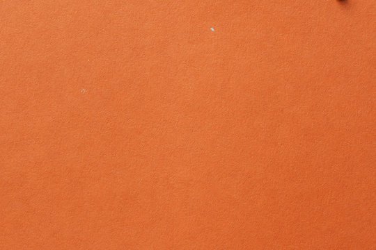 Yellow color cardboard. Clean orange paper texture. High resolution photo. Empty orange backgrounds.