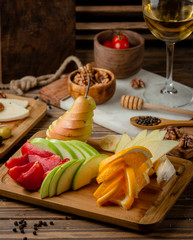 assortment fruits served in the board dish