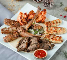 azeri kebab is served with lula kabab and ketchup in the plate