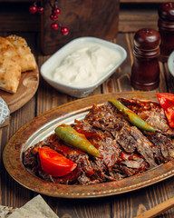beafsteak mixed with ketchup and fresh tomato in the dish