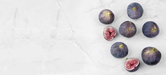 Top view of Ripe sweet figs (ficus carica) on a stone table.banner background with copy space 