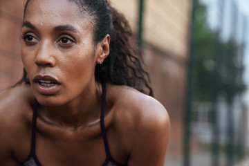 Image closeup of athletic african american woman standing outdoors