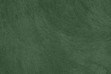 Elegant ark green Concrete textured background to your concept or product. Winter 2020 color trend.