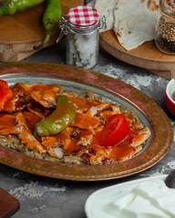 chicken meet is mixed with ketchup and fresh vegetables