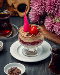 chocolate ice cream with strawberry jam in the glass