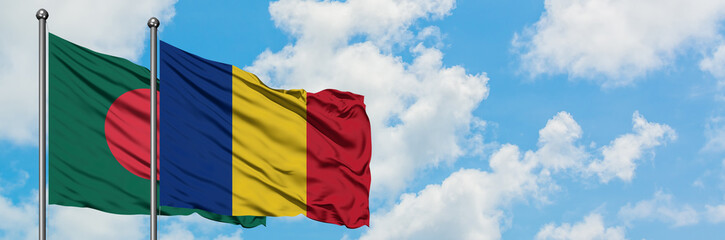Obraz premium Bangladesh and Romania flag waving in the wind against white cloudy blue sky together. Diplomacy concept, international relations.