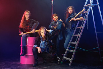 Rebel youth. Full length portrait of cocky children in stylish jeans and leather clothes. Concept...