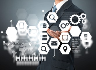 Businessman and  analytics symbol on  background