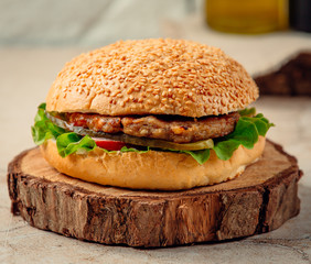 hamburger is served with cotlet and greens inside