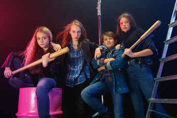Rebel youth. Full length portrait of cocky children in stylish jeans and leather clothes. Concept...