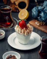 ice cream decorated with strawberry jam in the glass