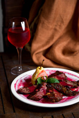 kebab mixed with cornel souce and served with red wine
