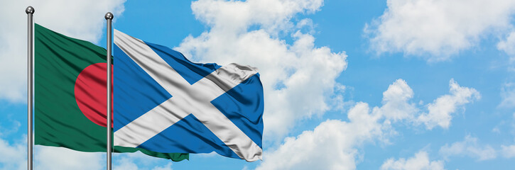 Bangladesh and Scotland flag waving in the wind against white cloudy blue sky together. Diplomacy concept, international relations.