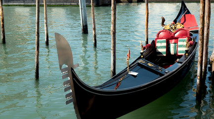 Fototapeta na wymiar Lovely gondola on the Grand Canal in Venice, Italy