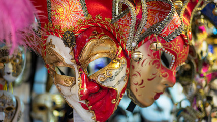 Beautiful venetian masks in store on street, traditional carnival of Italy.