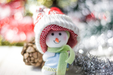 Christmas symbol - happy snowman in a red hat.