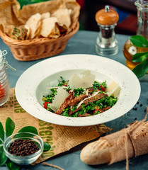 vegetable greens salad with dried bread in the plate