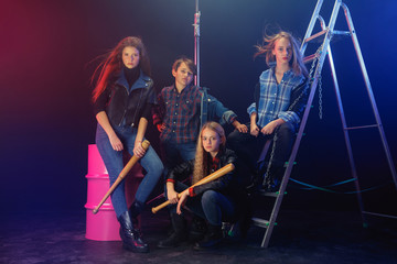 Rebel youth. Full length portrait of cocky children in stylish jeans and leather clothes. Concept...
