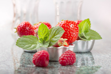 Strawberries and raspberries with mint