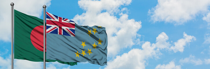 Bangladesh and Tuvalu flag waving in the wind against white cloudy blue sky together. Diplomacy...