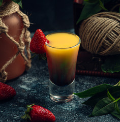 fresh summer cocktail is designed with fresh strawberry on the table