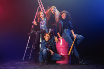 Rebel youth. Full length portrait of cocky children in stylish jeans and leather clothes. Concept...