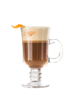 Irish coffee with orange peel in coffee mug isolated on white background
