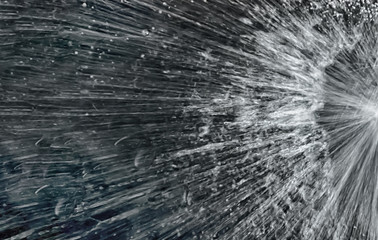 Blurred images of flowing water spreading on a black background