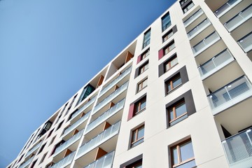 Modern apartment buildings on a sunny day with a blue sky. Facade of a modern apartment building