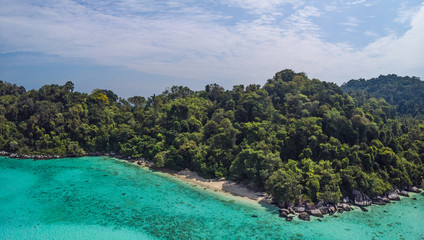 A diving trip in the crystal clear water in front of a lonely island in Southeast Asia