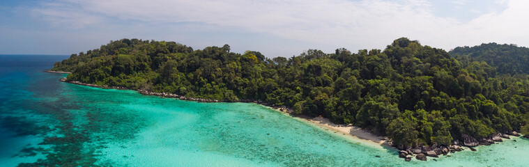 A diving trip in the crystal clear water in front of a lonely island in Southeast Asia