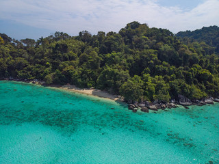 A diving trip in the crystal clear water in front of a lonely island in Southeast Asia