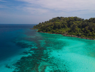 Fototapeta premium A diving trip in the crystal clear water in front of a lonely island in Southeast Asia