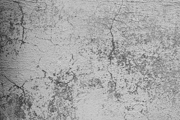 Texture of a concrete wall with cracks and scratches which can be used as a background