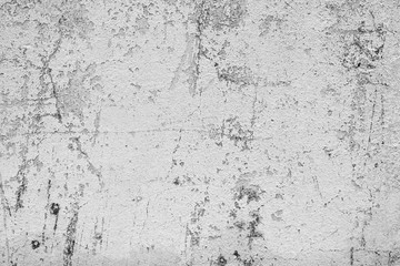 Texture of a concrete wall with cracks and scratches which can be used as a background