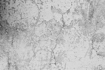 Texture of a concrete wall with cracks and scratches which can be used as a background