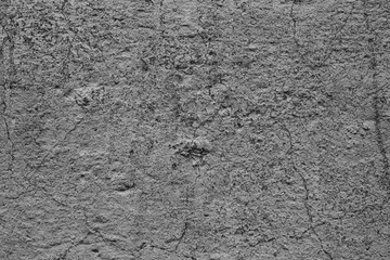Texture of a concrete wall with cracks and scratches which can be used as a background