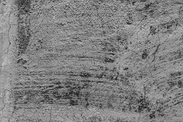 Texture of a concrete wall with cracks and scratches which can be used as a background