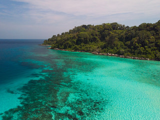 Fototapeta premium A diving trip in the crystal clear water in front of a lonely island in Southeast Asia