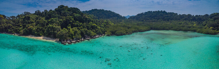 A diving trip in the crystal clear water in front of a lonely island in Southeast Asia