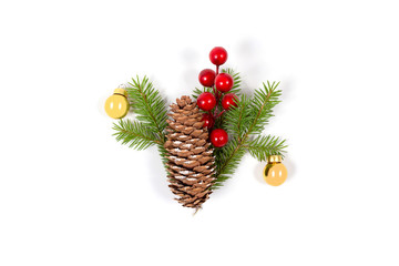 Fototapeta premium Christmas concept. Composition with cone, fir branch, golden balls and red berries. Top view. Isolated on white bakground. New Year greeting card.