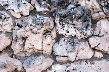 Natural porous stone background. Black and white stones texture.