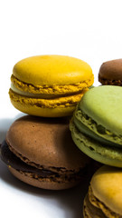 Colored macarons isolated on white background, typical French dish
